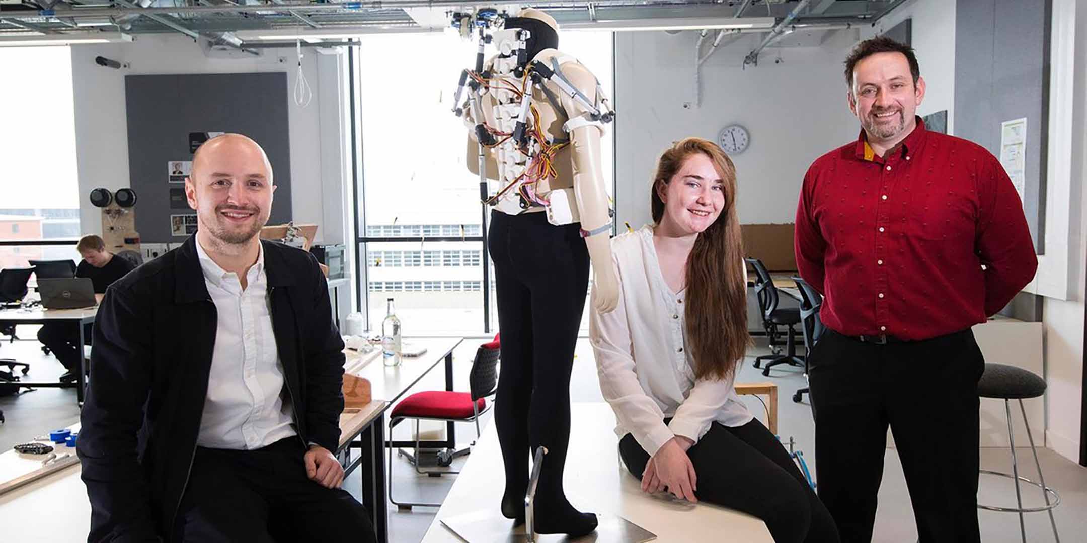 UCLan team with the 3D printed exoskeleton